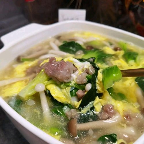 Mom's poached pork soup (cuan rou tang) - silky starchy-coated pork with mushrooms, greens and egg ribbons in a clear broth