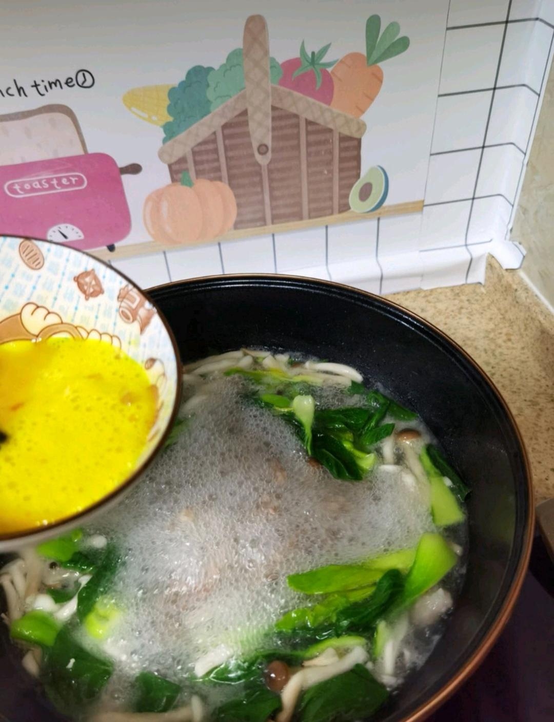 Finally, drizzle the beaten egg into the pot in a slow, steady stream while the soup is still hot, then turn off the heat. Season with salt and shrimp powder (or chicken bouillon) and give it one gentle stir.