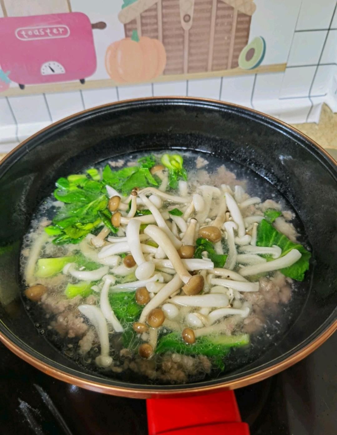 Add the sliced mushrooms and leafy greens and cook until the greens are just tender — bok choy needs a minute or two, spinach barely thirty seconds.