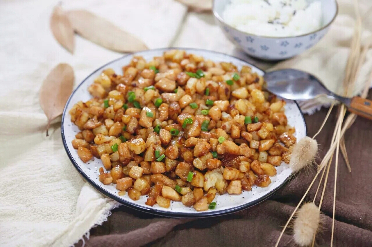 Golden potato cubes with diced chicken breast in a simple soy glaze