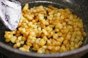 Lay the potato cubes flat and do not stir until one side turns golden