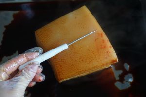 Prick the pork skin all over with a toothpick so it blisters when fried.