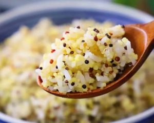 Fluff the cooked three-color quinoa rice and serve hot.