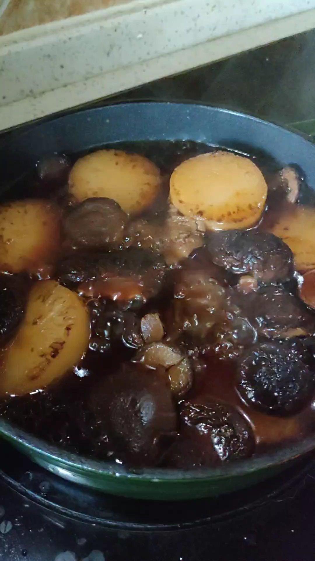 Season with light soy, dark soy, oyster sauce and sugar, then cover and simmer 30 to 40 minutes.