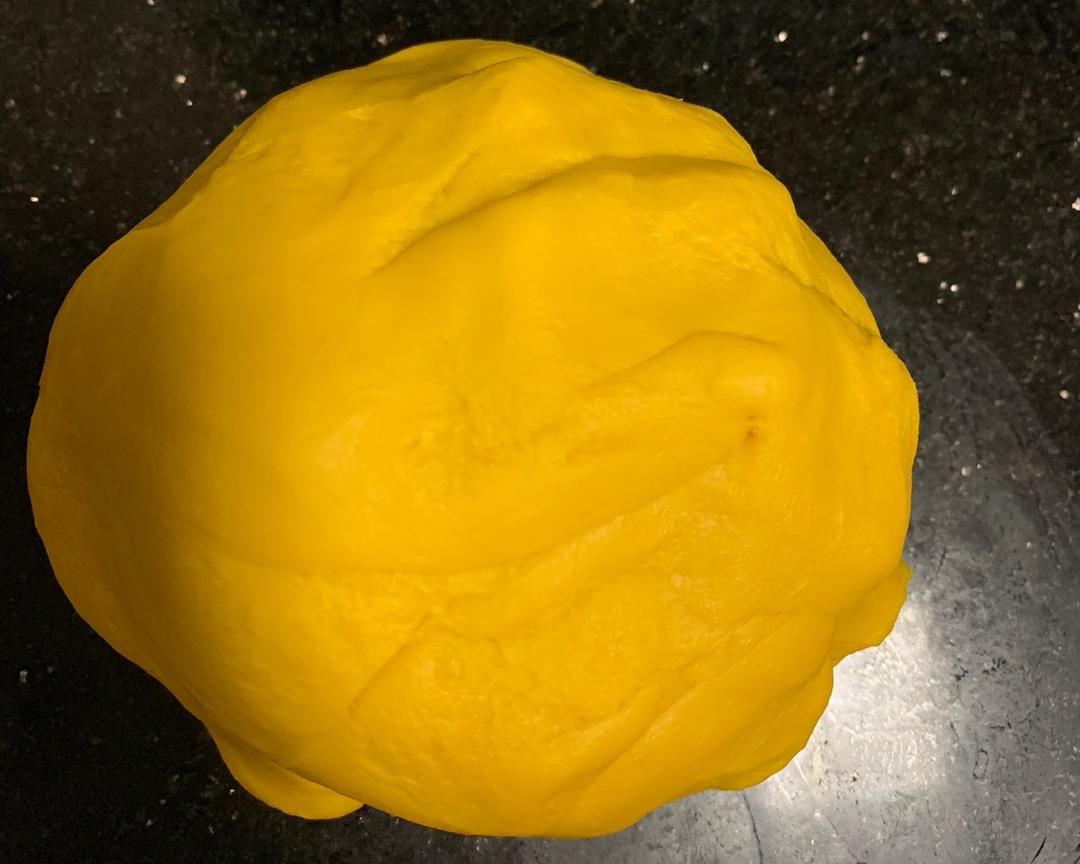 Kneading the pumpkin dough into a smooth ball