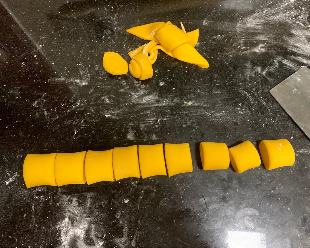 Cutting the rolled dough into individual buns