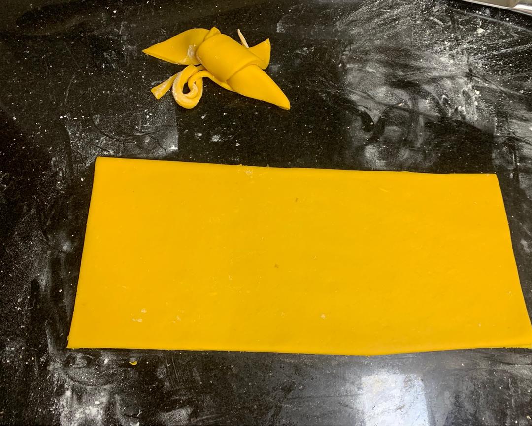 Trimming the rolled dough sheet