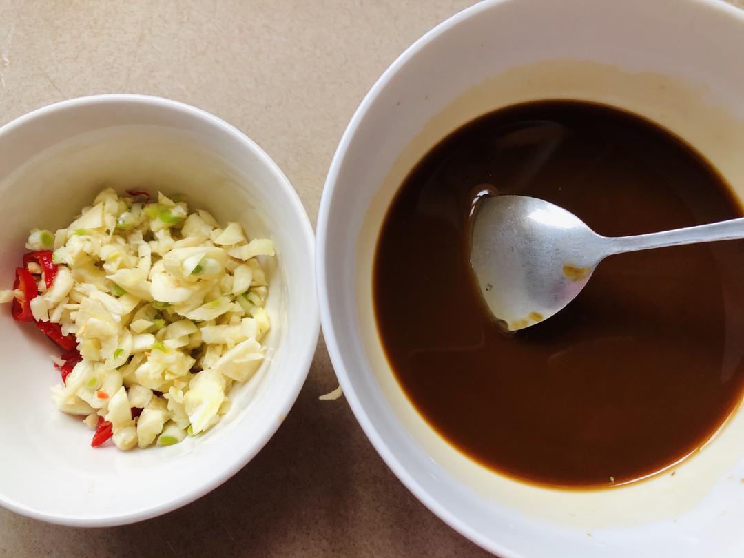 Mincing garlic and chili for the sauce