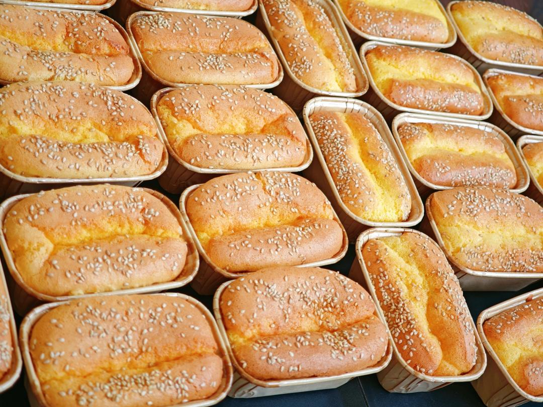 The kitchen smells like a bakery stall - rice, honey and toasted sesame.