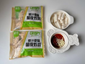 Set out the frozen fried chicken, rice cakes, and sauce ingredients
