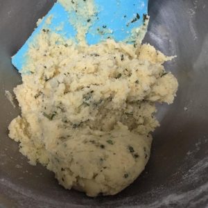Fold in the sifted flour, then the chopped rosemary