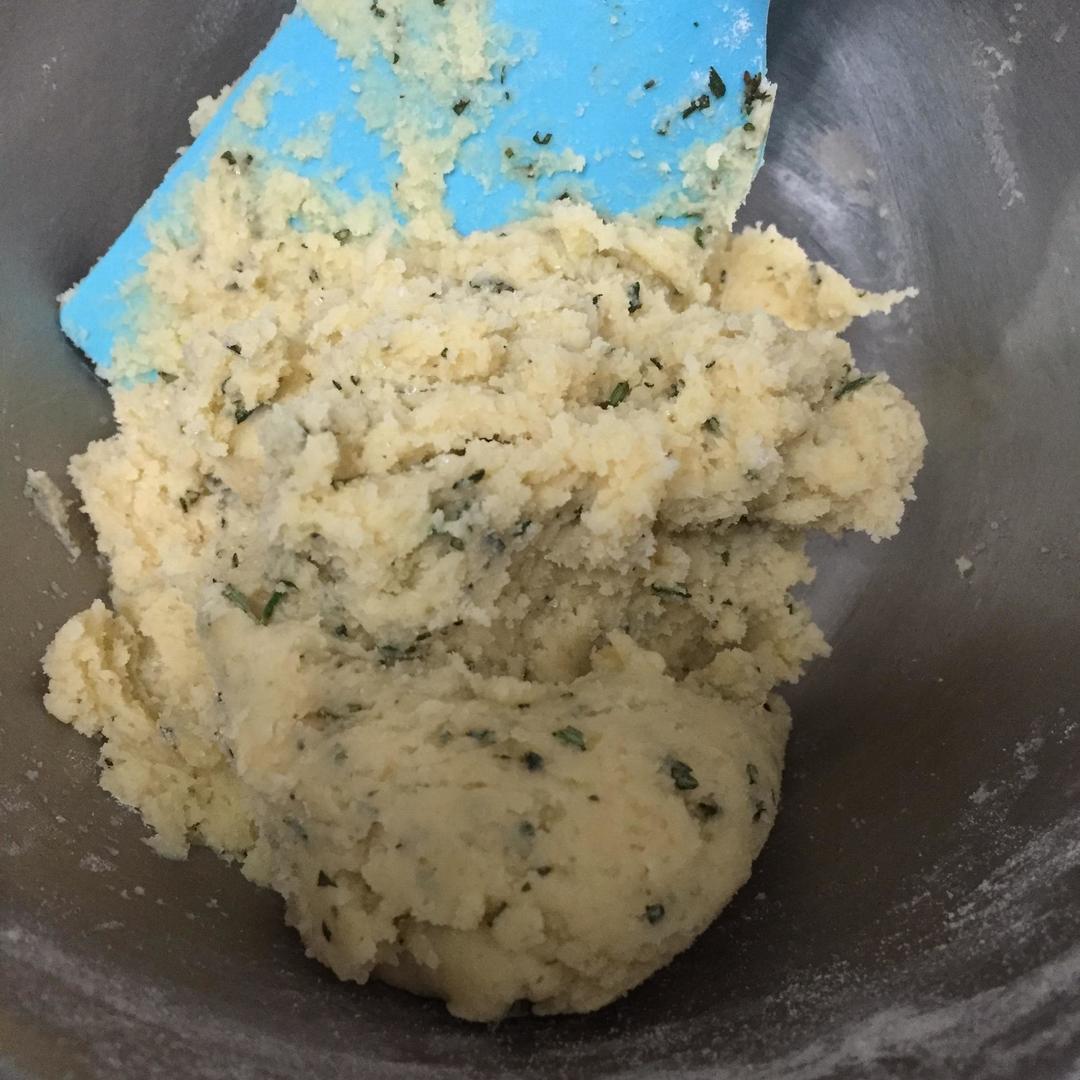 Fold in the sifted flour, then the chopped rosemary