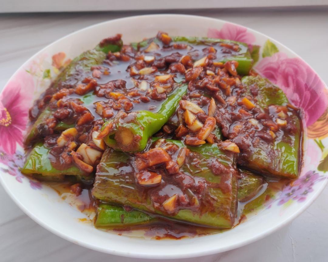 Toss the blistered peppers through the bubbling sauce until coated