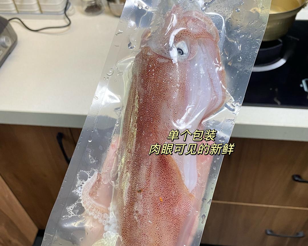 Clean the squid: remove the ink sac, water sack, beak, and eyes