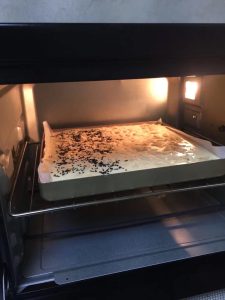 Top the batter and tap the pan three times to release bubbles