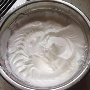 Whip the meringue to stiff peaks with a short upright tip