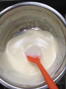 Pour the batter into the remaining meringue