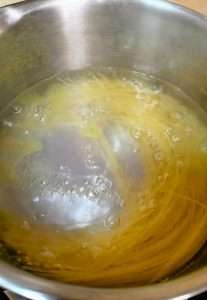 Boil the pasta in salted water with a splash of olive oil until just al dente