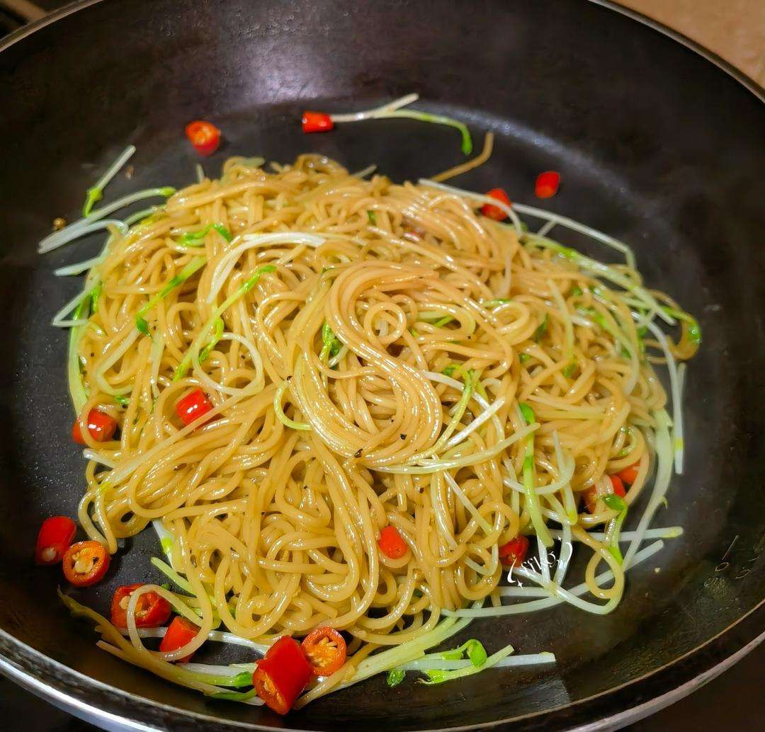 Toss the pasta with pea shoots, chilies, and sliced steak strips until just combined