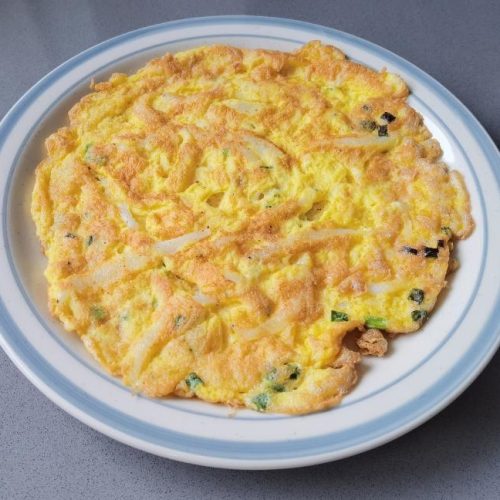 Golden silverfish omelet with a crisp edge