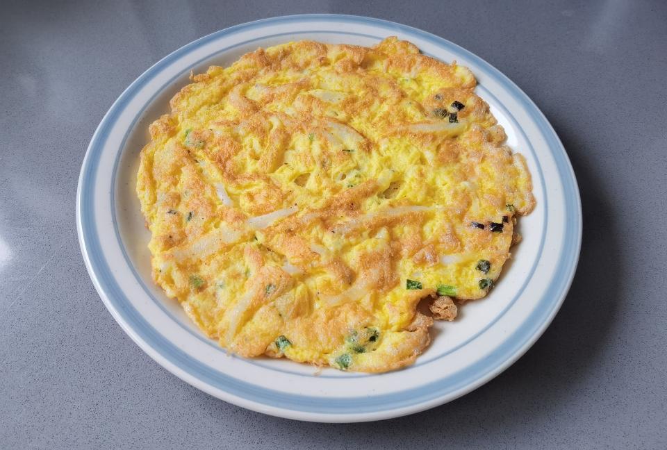 Golden silverfish omelet with a crisp edge