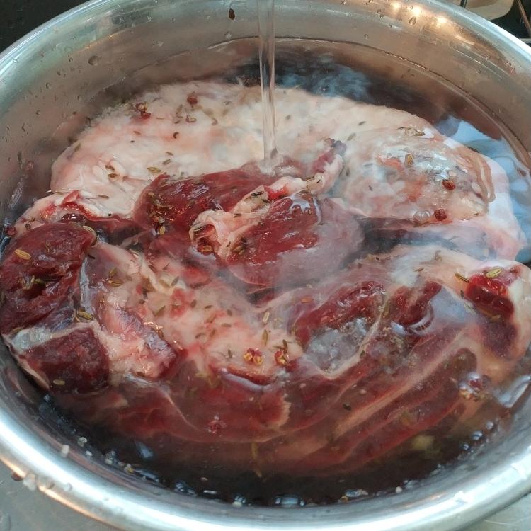 Rinse or rub the surface salt off the cured beef