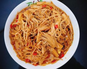 Stir-fry the enoki with the chili-garlic oil and soy-oyster glaze until silky