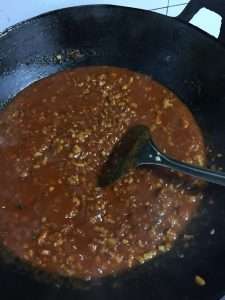 Add water and simmer the pork sauce on low heat until it thickens to a glossy coating