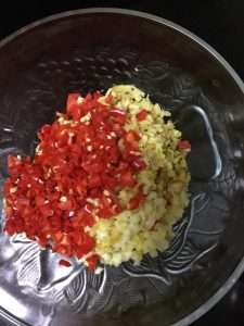 Mince the bird's eye chilies, ginger, and garlic together for the aromatics