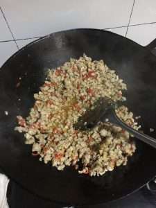 Stir-fry the pork until the cubes turn white and are about half cooked