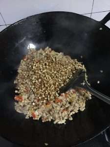 Add the five-spice dried tofu cubes and toss to coat them in the seasoned oil