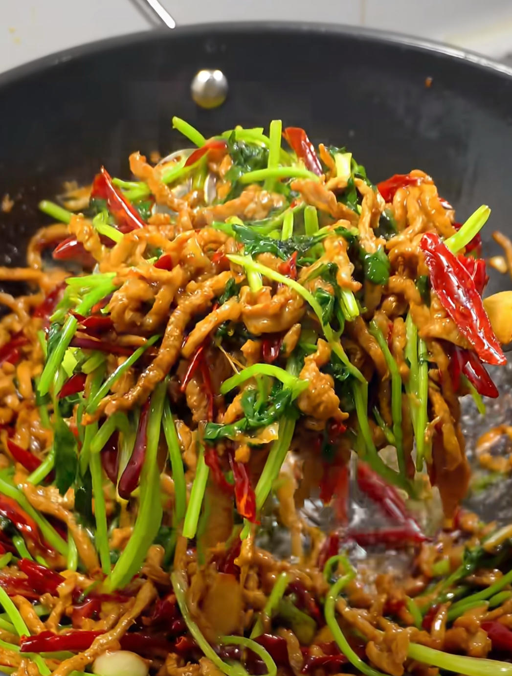 Spicy shredded pork with cilantro and crispy chili threads