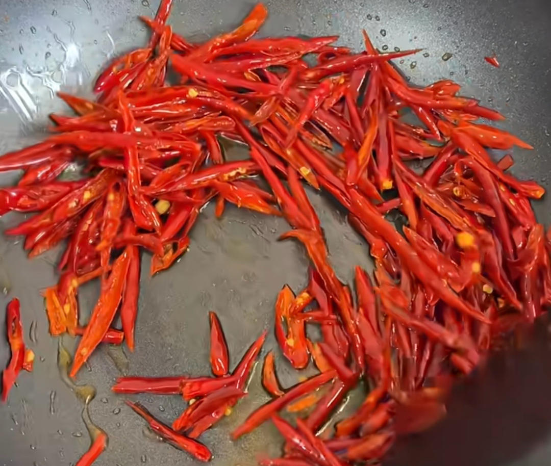Fry the chili threads in generous oil until crisp, then set aside