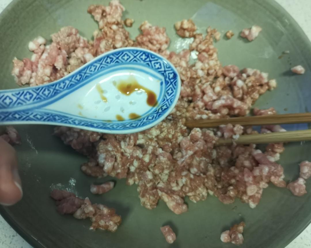 To the minced pork add 1 spoon light soy + 1