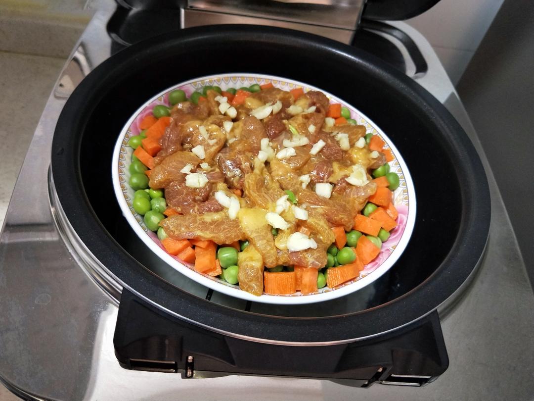Set the bowl on the rack above the rice in the rice cooker