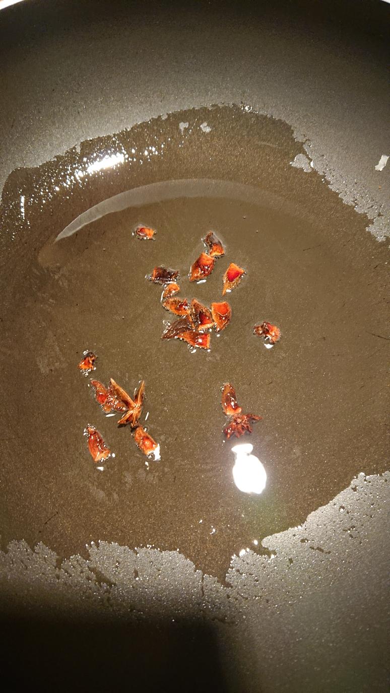 Frying star anise in hot oil for the eggplant gravy