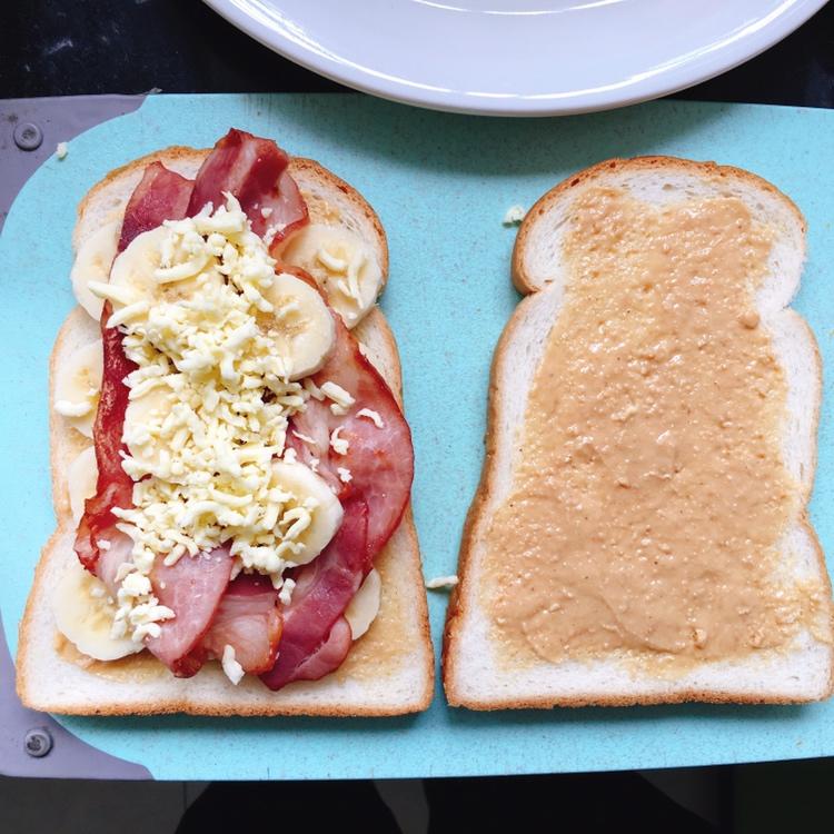 Spreading peanut butter on the bread for Elvis panini