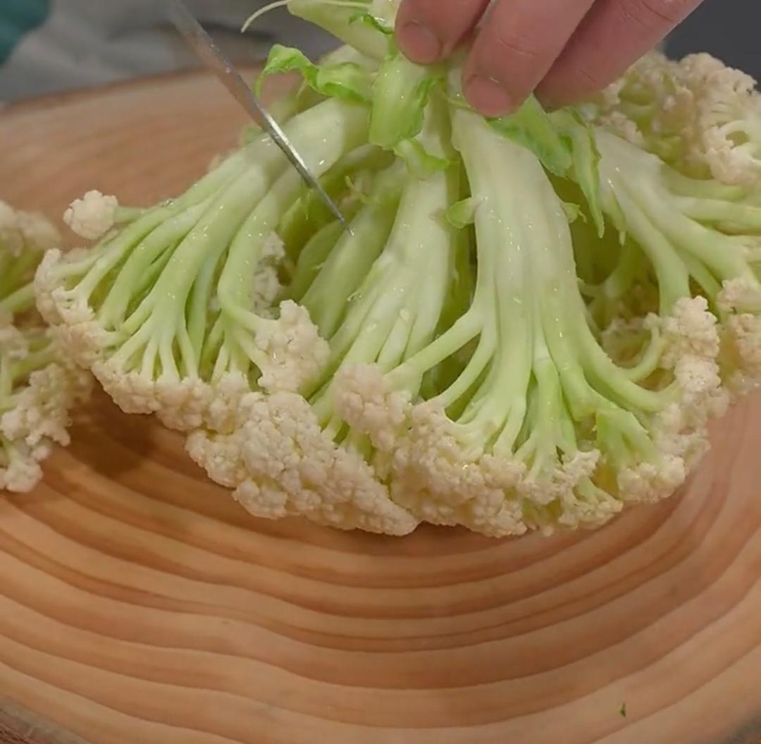 Cutting cauliflower into small florets for Dry Pot Cauliflower
