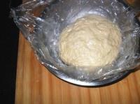 Youtiao dough rested in a covered bowl