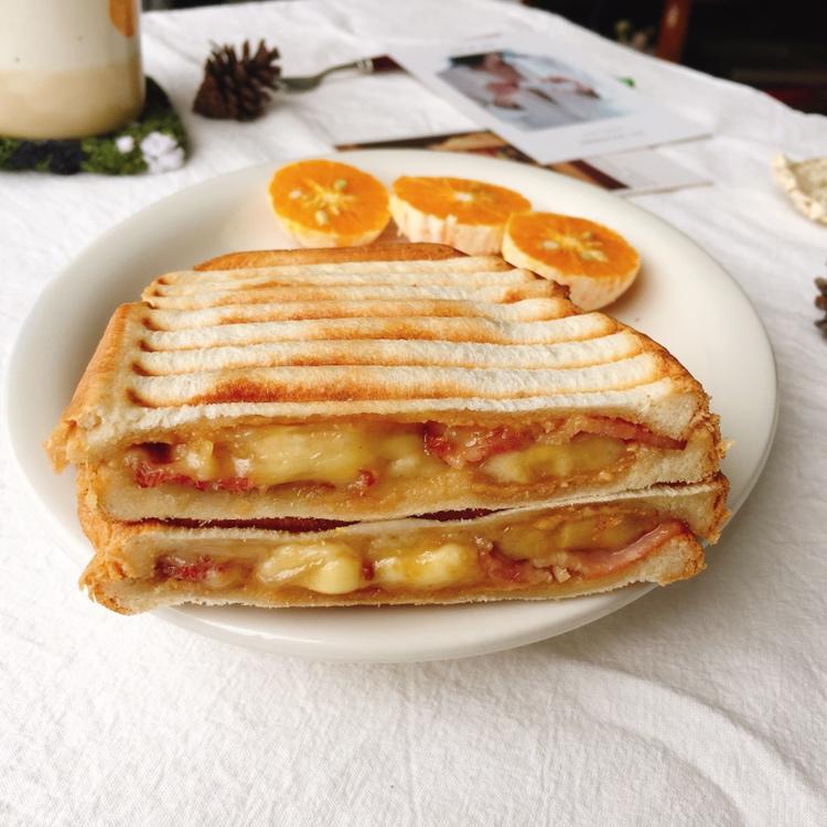 Golden grilled Elvis panini with melted cheese