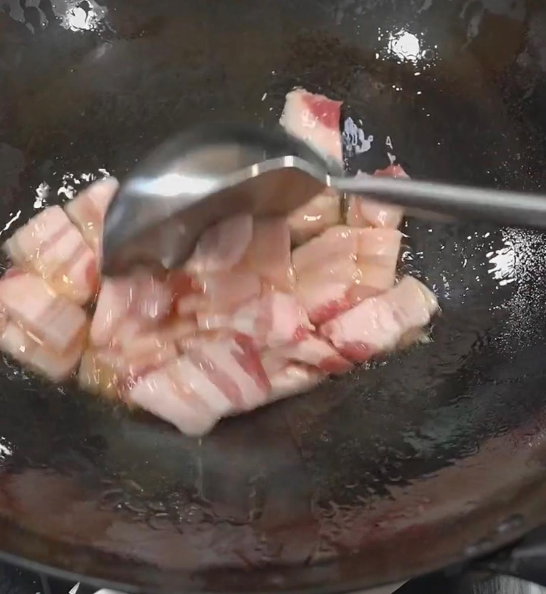 Rendering pork belly in a wok