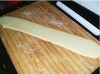 Rolling out youtiao dough on a floured board