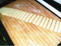 Cutting youtiao dough into strips