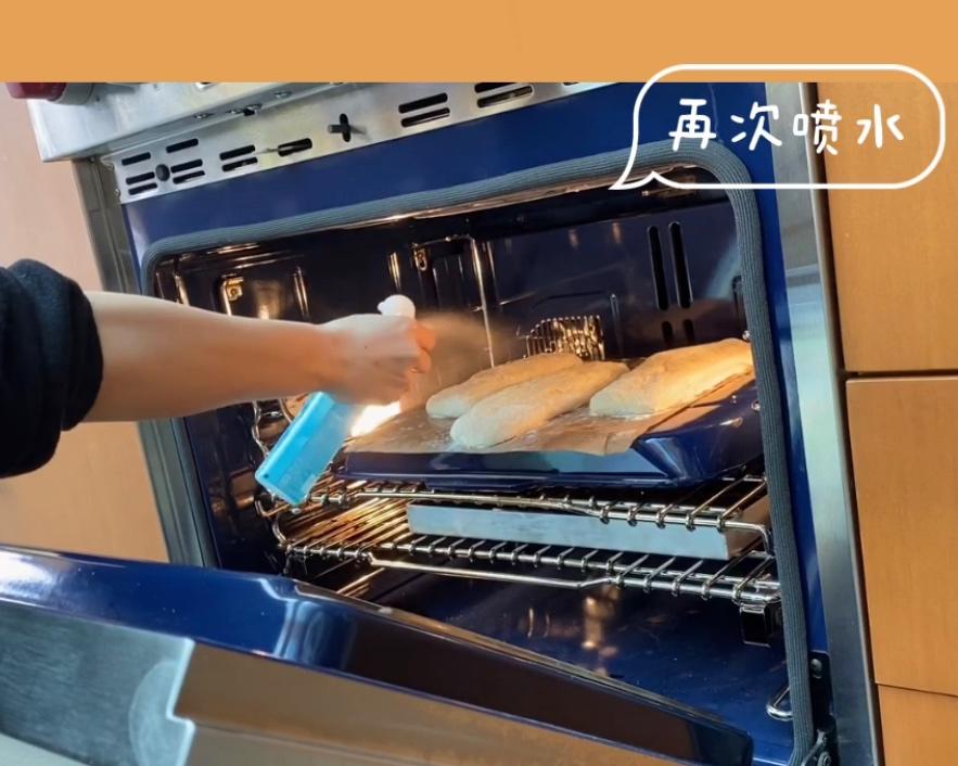 Spraying water inside the preheated oven