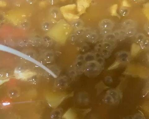 Adding milk to finish Japanese curry sauce