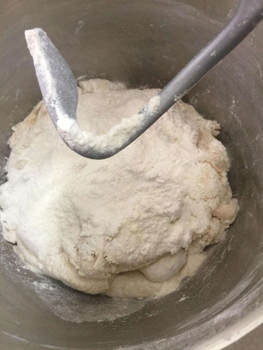 Degassing: Return dough to the mixer. On low