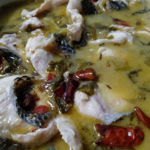 Suan cai yu with velveted fish fillets in sour mustard broth
