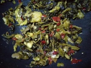 Stir-fry the mustard greens until dry to wake the sourness