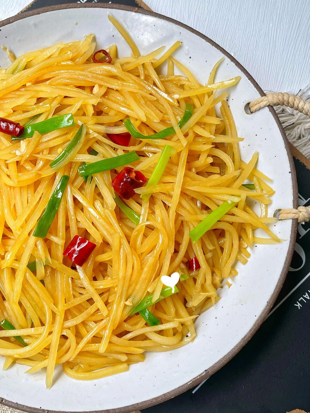 Oyster sauce hot and sour shredded potatoes (suan la tu dou si) - crisp potato matchsticks in a glossy, tangy, chili-flecked sauce