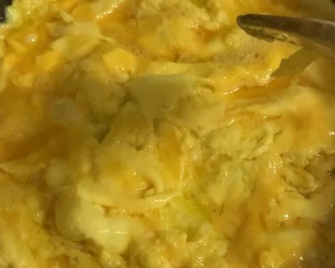Pour in the eggs and stir-fry until half-set